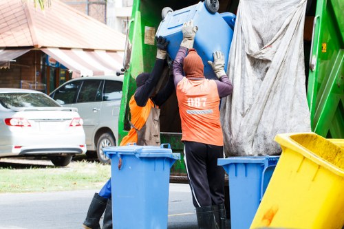 Supervisor conducting a safety briefing with waste collection staff